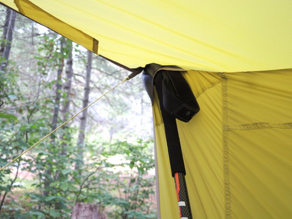 Nylon pockets for trekking poles at the top of tent. Tentesity 8